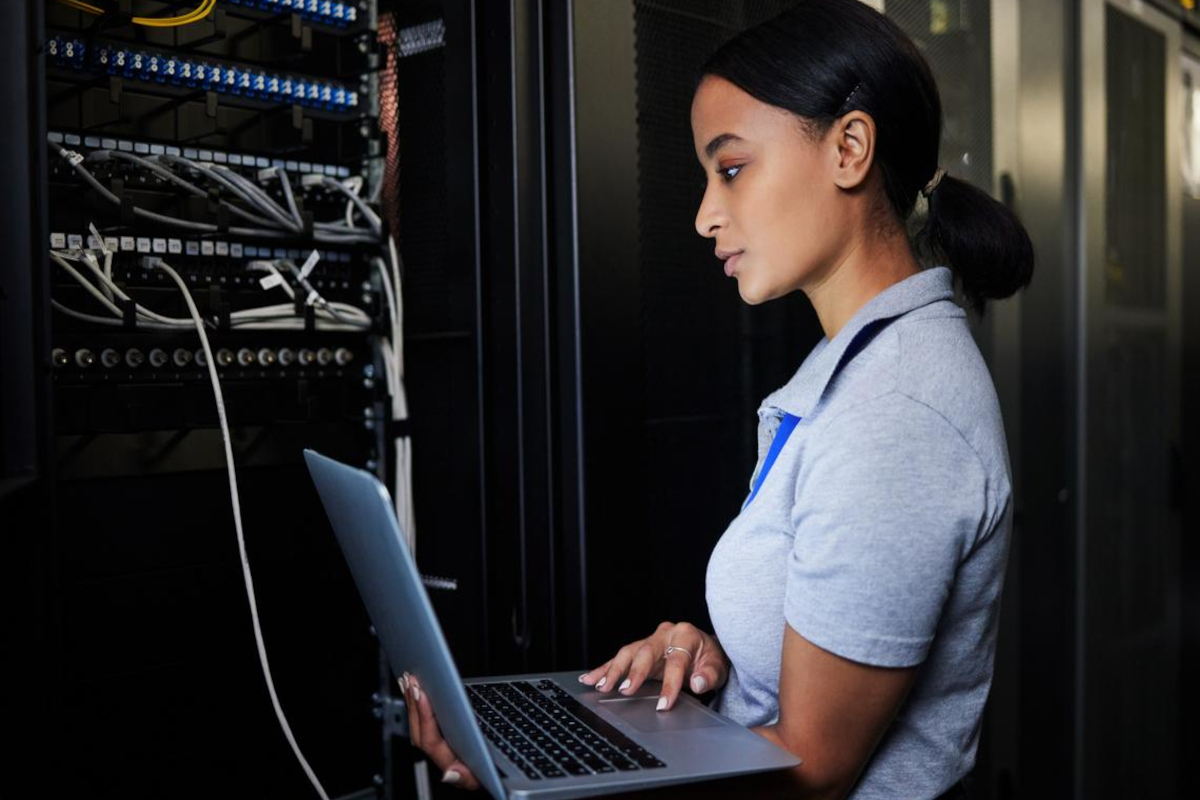 Woman working in server monitoring room