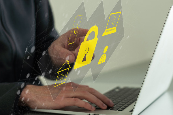 Businessman uses a laptop to log in by password with virtual padlock screen