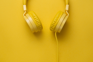 Yellow headphones on yellow background